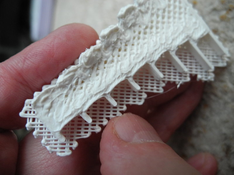 The overhangs warp upwards during printing.